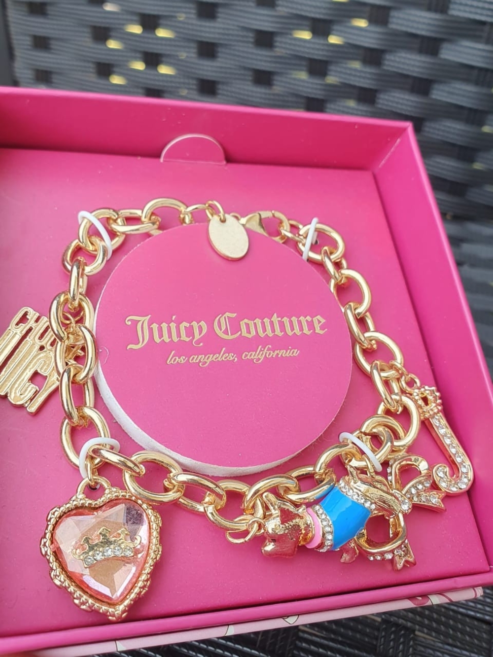Juicy Couture Gold Charm Bracelet with Pink and Blue Accents